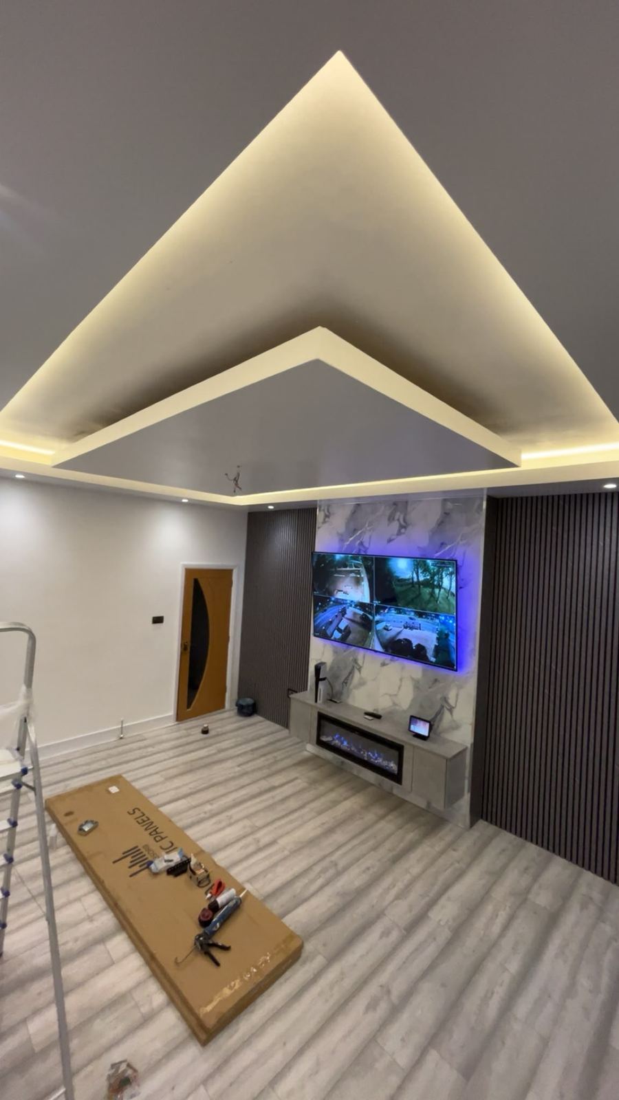 Living room feature wall and ceiling lighting finished by Brush It Up, Leeds